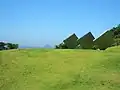 The garden at the Naoshima Fukutake Art Museum, using sculpture to imitate the form of island on the horizon