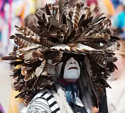 A modern-day Cheyenne dog soldier wearing a feathered headdress during a powwow at the Indian Summer festival in Henry Maier Festival Park, Milwaukee