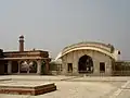 Wider view of the quadrangle, minarets of Badshahi Mosque visible in background