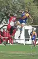 Aronson Eobob leaps high over Canada's Emmanuel Mattata in the ruck in 2008.