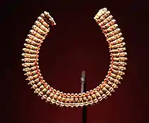 Necklace made of 54 composite human head and ram's head gold pendants with a small carnelian bead between each. Meroitic Period, 270–50 BC