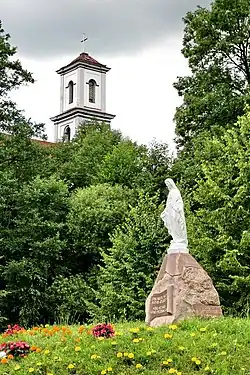 Sculpture of Mary at the center of the city and the church