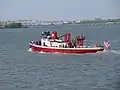 John J. Harvey underway near the Statue of Liberty