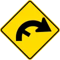 (PW-26) Curve between 90 and 120 degrees with minor road, to right