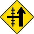 (W15-1B/PW-13b) Railway level crossing on side road to left