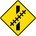 (W15-8.2/PW-60.1) Railway crossing ahead at an oblique angle