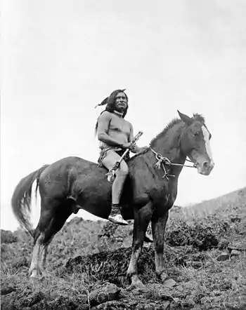 The old-time warrior: Nez Percé, c. 1910. Nez Percé man, wearing loin cloth and moccasins, on horseback.