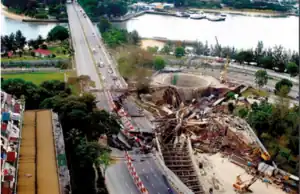 A destroyed highway with a gaping hole in the collapse site