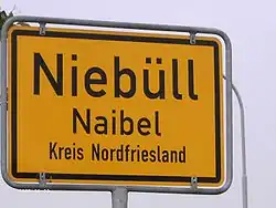 Bilingual sign in North Frisia (Germany) with the German name above and the North Frisian name below