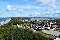 View of Niechorze from the lighthouse with the beach and Baltic coast on the left and the Liwia Łuża Lake on the right