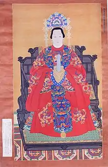 Ming Dynasty noblewoman wearing a crown with 9 pheasants and traditional Ming dress, known as fengguan xiapei