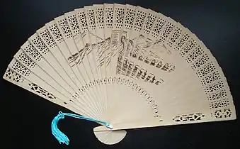 Image 45A commercially produced scented wood folding fan, featuring a drawing of the Great Wall of China. (from Chinese culture)