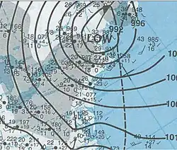 Map of the northeastern United States, showing a more tightly wound storm. The low center is situated over northern New England, although precipitation extends well to the west.