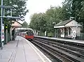 Northbound platform looking north with a Northern line train leaving the station