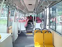 Image 235Interior of a wheelchair-accessible transit bus, with bucket seats and smart-card readers at the exit. (from Transit bus)