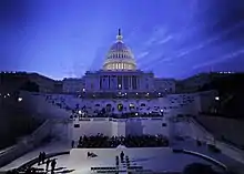 U.S. Capitol at dusk, mostly darkened but with dome floodlit from within