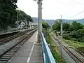 The dead-end station tracks on the switchback (left), with the main line seen descending towards Shinanoi on the right