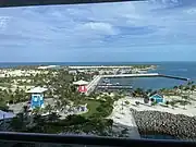 View from a cruise ship overlooking the island with the marina to the right.