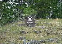 A small sign marking Octopus Provincial Park in the center of a clearing