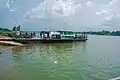 A loaded pontoon (goods, cars and people) at Oguta Lake