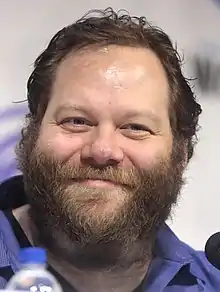 Ólafur Darri Ólafsson close-up, smiling at the camera