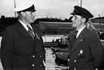 Crownprince Olav of Norway, member of the Jury in Helsinki, with Norwegian Dragon sailor Thor Thorvaldsen (right).