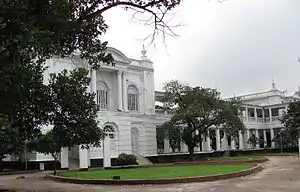 Large white building, with many pillars