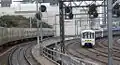 Looking east from a train on the new Viaduct, towards Southern Cross and a train on the old viaduct.