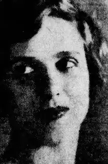 A young white woman with large eyes looking to her right