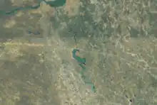 Aerial view of the Etaka River with the Olushandja Dam on the north side.