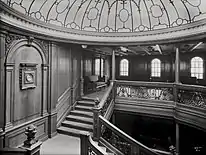 The A-Deck level of the first class aft Grand Staircase of Titanic''s sister ship, the Olympic, by Welch