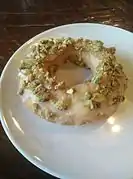 An orange- and pistachio-flavored old-fashioned doughnut