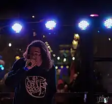 Orikal Uno performing live in Minneapolis wearing Graff Roots Media hoodie