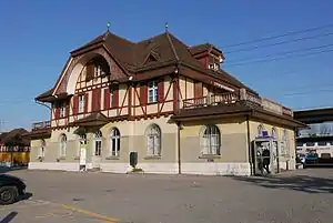 Three-story building with gabled roof