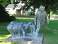 Shepherd with sheep statue