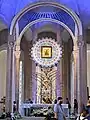 The icon in its mosaic frame, enshrined above the high altar, which is covered by a ciborium.