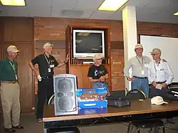 Skeptical Toolbox regular Ben Baumgartner (far right) presents the faculty with Skeptic's Toolbox hats. From left Wallace Sampson, James Alcock, Ray Hyman and Barry Beyerstein. August 2005