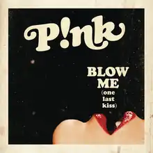 A black picture with a beige border. In the upper part of the image the word P!nk is written in beige. On the lower right side of the picture is located a close-up of an opened mouth wearing red lipstick. The words BLOW ME are written in capital letters. The words (one last kiss) are written below in lower-case letters. Both phrases are displayed above the mouth.