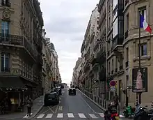 Color photograph of a Paris street and buildings.