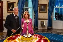 President Joe Biden and First Lady Jill Biden light a diya in the Blue Room to celebrate Diwali, 2021