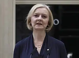 Truss outside 10 Downing Street, standing at a wooden lectern