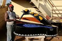 Paa Joe with his sandals coffin made for the Kunstmuseum Bern (2006)