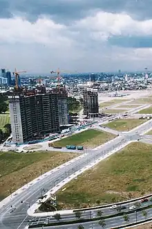 One McKinley Place (right) with Pacific Plaza Towers (left) under construction February 1999