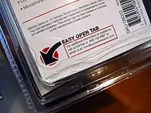 A ridged plastic clamshell package with a label reading "Easy Open Tab"