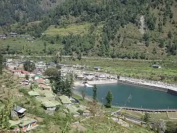 Aerial view of small town and reservoir