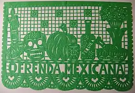 A picture of a green papel picado made for an oftenda