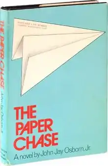 Paper airplane with the address to Harvard Law School at green-ish blue background and above the red title "THE PAPER CHASE".