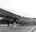 Peggy Jean performing on the sideline with an Army band