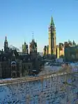 The East Block (left) and West Block (beyond), with its Mackenzie Tower, frame the south facade and Peace Tower of the Centre Block