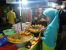 Vendor selling rissole at the pasar malam (night market) in Rawasari, Jakarta